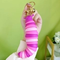 Pink and purple articulated caterpillar fidget toy with gold keychain and bell - Caterpillar - Pink