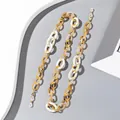 Detail of amber and marble resin chain with gold metal rings and lobster clasps - Yellow/White Cloud Marble