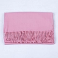 Solid soft pink cashmere-like scarf with fine tassels neatly folded for winter styling - Dusty Rose