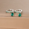 Detailed macro view of S925 silver earring with emerald green pear-cut drop stones - Silver Green Zirconia