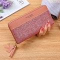 Women's pink long zip wallet featuring glitter patchwork and tassel bird charm - Deep Pink