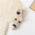 Soft beige coral fleece socks with cute black cat pattern on warm plush background - One Size / White