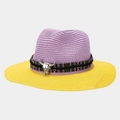 Detail of steer skull metal charm on purple and yellow woven straw panama hat - Purple and Yellow Brim