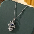 Turkish Evil Eye necklace featuring a Hamsa Hand pendant with silver finish and crystals - A4-Silver