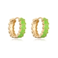 Macro shot of gold-plated hoop earrings with green enamel and white floral pattern - Green