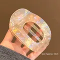 Detail view of 10cm opalescent acetate hair clip showing the holographic material - Iridescent Yellow