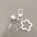 White acrylic star keychain set with metal bell and matching D-ring connector - White