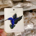 Sparkling hummingbird brooch with blue and green crystals on a jewelry card - Antique Silver Royal Blue + Green