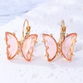 Close-up of pink crystal butterfly drop earrings with gold metal edges and white rhinestones - Gold Champagne