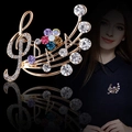 Luxury gold music note brooch with vibrant multicolored rhinestones on black background - Colorful Staff Gold (XD825314-1)