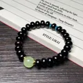 Bracelet en bois de santal noir avec charme de jade vert et perles bleues sur parchemin - Ébène du Mozambique Perles de Boulier avec Perle Lumineuse