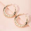 Detailed view of large gold hoop earrings with vintage embossed floral swirl patterns - Vintage Geometric Embossed Hoop