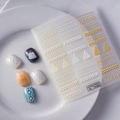 Close-up of 5D embossed nail stickers featuring white knitting patterns and winter motifs - Gold White Snowflake Bow Knitting Style (TS-005)