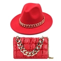 Detail of red fedora hat and quilted leather bag with chunky gold chain accents - Red Hat + Bag