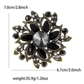 Elegant gold and black flower brooch with rhinestones including size and weight specs - Black