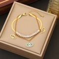 Golden double-layer evil eye bracelet with cubic zirconia on a jewelry box - Double Layer Evil Eye Bracelet
