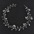 Macro detail of silver bridal headband featuring marquise crystals and woven wire - Silver