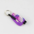 Macro view of purple diamond-encrusted car window breaker and key ring tool - Purple Stripe