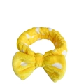 Soft yellow coral fleece headband featuring white polka dots and a large decorative bow - Yellow Polka Dot