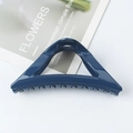 Elegant deep blue triangular hair claw clip with smooth finish on decorative card - Glossy Navy Blue