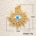 Macro detail of gold-plated sun pendant with evil eye and measurements 20mm by 18mm - A0199 Sun Eye Pendant