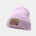 Close-up of light purple ribbed beanie showing dense knit texture and brown leather patch - Light Purple