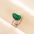 Detailed view of silver open ring with pear-shaped green malachite stone on beige fabric - Silver Base Green Malachite (J550-S-G)