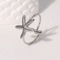 Minimalistischer silberner Seestern-Ring aus Edelstahl mit verstellbarem offenem Design - Stahlfarbe