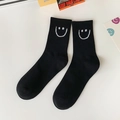 Cotton crew socks in black featuring a white embroidered smiley face and ribbed cuffs - One Size / Black White Smile at Cuff