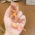 Cute lollipop liquid keychain with orange beads and matching metallic ring holder - Orange Lollipop Milk Bean