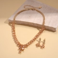 Detail of luxury gold zircon wheat pendant set with champagne crystals on stone display - Necklace-Earring Two-Piece Set / Champagne