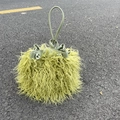 Close-up of lime green faux sheepskin bucket bag with plush texture and PU leather drawstring - Matcha Green