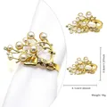 Golden reindeer napkin ring with pearls and rhinestones on a white fabric napkin - Deer Head Pearl Rhinestone (43)