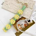 Handmade woven daisy flower keychain in yellow and green with white beads and gold clasp - Light Green + Light Yellow