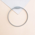 Detailed close-up of a grey coated metal wire keychain with a secure screw fastener - Gray