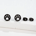 Detail of matte black stainless steel stud earrings featuring hollow animal paw print - 438 Black (Paw Print)