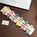 Set of 12 matte macaron color mini ball hair claws in pastel tones on a card display - Set-13 / Random Color
