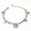 Detail of silver double-layered chain bracelet with textured heart charms and lobster clasp - Steel-Heart