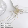 Detailed macro view of butterfly hair claw with tassels, rhinestones and dimensions - Iridescent Bow Tassel Claw Clip