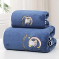 Detail of navy blue coral fleece bath towel set with Moon Rabbit embroidery and soft texture - Moon Rabbit Blue