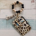 Detail of leopard print card holder with silicone bead bracelet and stylish tassel - Yellow Leopard