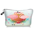 Detail view of flamingo print cosmetic bag with secure zipper and durable side handle - Light Blue Sunset