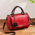 Vintage dark red Boston handbag with cracked leather texture and rose charm - Red