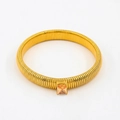 Detailed view of flexible gold-tone snake bracelet featuring a square amber zircon stone - 10mm Width x 18cm Circumference / Champagne
