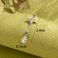 Silver bow belly ring with red gem and teardrop zircon dangling pendant, 2.4cm length - Snake Note Motif Ruby Style (A413-6#1.2 Thick Rod)