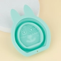 Mint green bunny-shaped silicone makeup brush cleaning bowl with textured scrubbing surface - Green