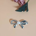 Silver bow hair clip with central pearl detail on a spring barrette clasp - Silver