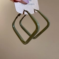 Macro view of olive green square geometric earrings with smooth lacquered finish on card - Olive Green