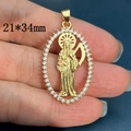 Close-up of gold-plated oval Santa Muerte pendant with white zircon inlays 21x34mm - Style A-Oval Zircon (21*34mm)