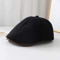 Detail view of newsboy cap featuring black fabric and brown textured woven brim - M (56-58cm) / Black